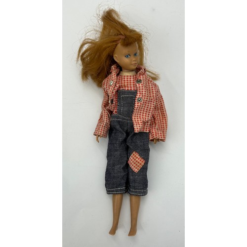 382 - A miscellany of items to include a 1963 Mattel 'Skipper' Doll with clothes by Sindy & Patch, a Royal... 