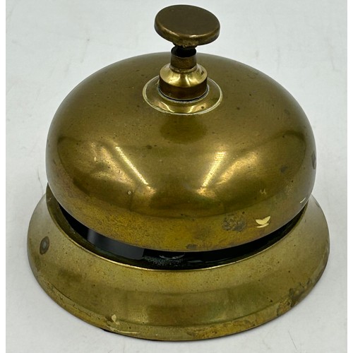 911 - Brass items to include a set of postal scales with complete weights, a terret and a countertop bell.... 