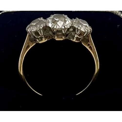 540 - A three stone diamond ring set in white gold setting with yellow gold shank. Old round brilliant cut... 