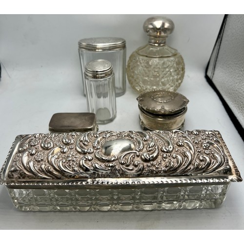 779 - A quantity of glass and silver dressing table pots to include Birmingham 1901, maker Thomas Hayes ob... 