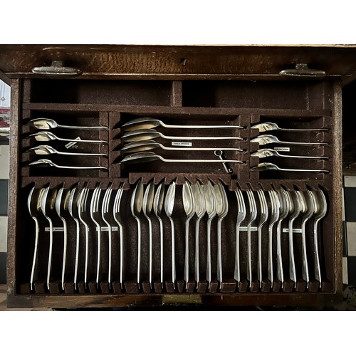 788 - A canteen of hallmarked silver cutlery in an oak cabinet comprising 8 soup spoons, 8 dessert spoons,... 