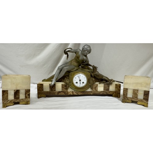 985 - An onyx mantel clock with a bronze figure of a girl and playing dog, marked Marseille, comes with ke... 