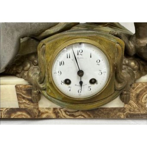 985 - An onyx mantel clock with a bronze figure of a girl and playing dog, marked Marseille, comes with ke... 