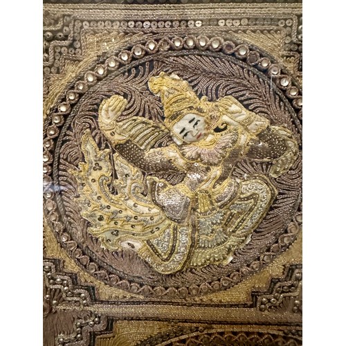 871 - A Burmese late 19thC framed relief panel with metal thread and bead work depicting five dancing figu... 