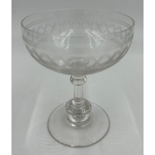 489 - A selection of mid century etched ribbon design glasses to include 10 x Champagne Coupes 12cm, 5 x s... 