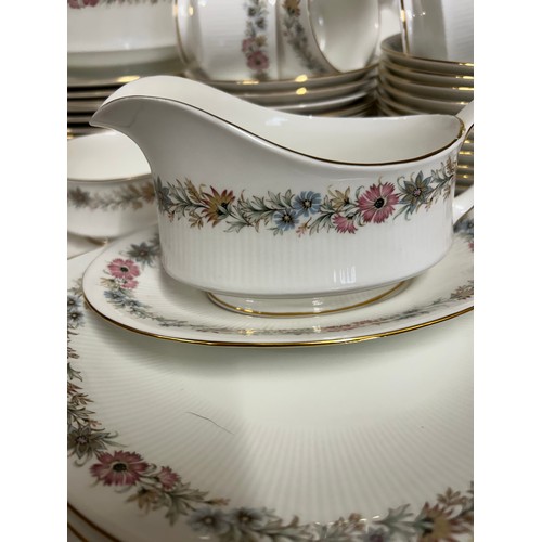 394 - A large quantity of Paragon 'Belinda' dinner and tea ware comprising : 12 x dinner plates, 2 x lidde... 