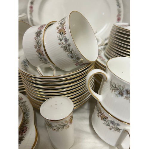 394 - A large quantity of Paragon 'Belinda' dinner and tea ware comprising : 12 x dinner plates, 2 x lidde... 