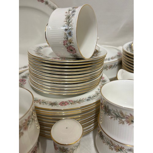 394 - A large quantity of Paragon 'Belinda' dinner and tea ware comprising : 12 x dinner plates, 2 x lidde... 