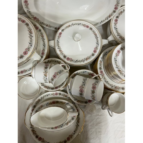 394 - A large quantity of Paragon 'Belinda' dinner and tea ware comprising : 12 x dinner plates, 2 x lidde... 