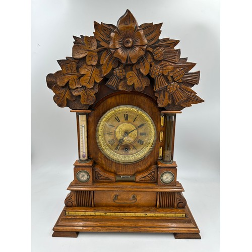 987 - A late Victorian oak cased bracket clock by The British United Clock Company with integrated thermom... 