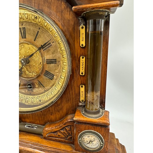 987 - A late Victorian oak cased bracket clock by The British United Clock Company with integrated thermom... 