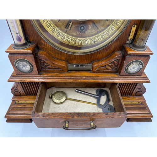 987 - A late Victorian oak cased bracket clock by The British United Clock Company with integrated thermom... 