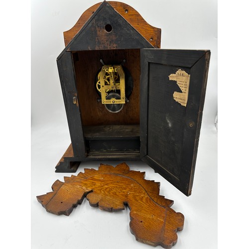 987 - A late Victorian oak cased bracket clock by The British United Clock Company with integrated thermom... 