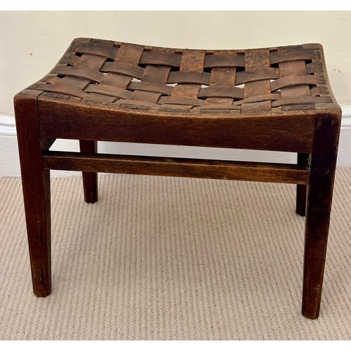 32 - Arthur W. Simpson, Kendal, an Arts and Crafts stool in oak, with original woven strap seat, and make... 