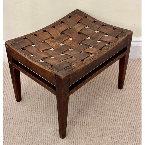 32 - Arthur W. Simpson, Kendal, an Arts and Crafts stool in oak, with original woven strap seat, and make... 