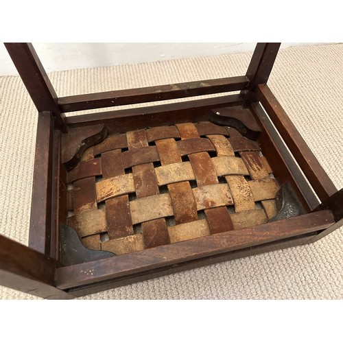 32 - Arthur W. Simpson, Kendal, an Arts and Crafts stool in oak, with original woven strap seat, and make... 