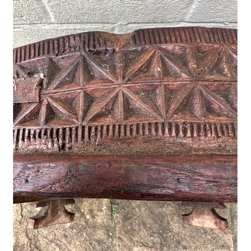 34 - An early 20thC Indian Chakki circular teak grinding table. Longest diameter 71cm w x 27cm h.