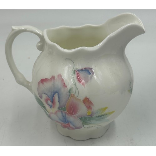 396 - A miscellany of ceramics to include Nao figurine April Showers, Aynsley milk jug Little Sweetheart a... 