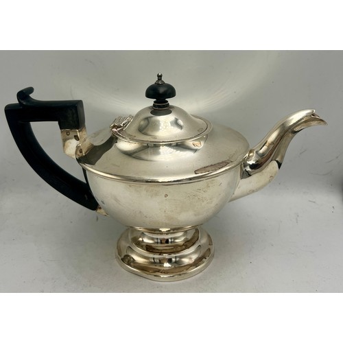 792 - Hallmarked silver teapot with ebony handle and knop. Birmingham 1938. Weight 439gm.