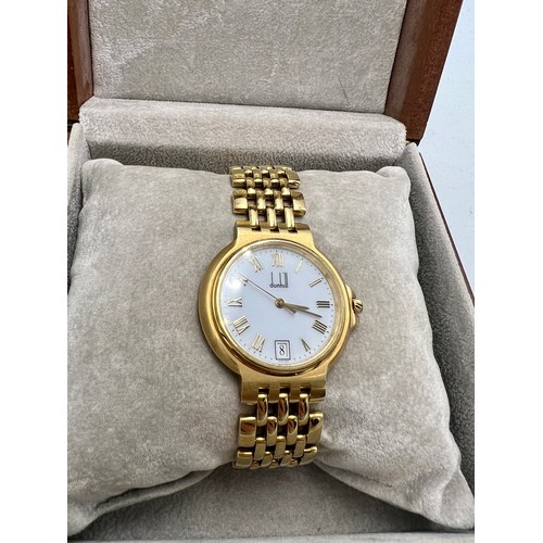 709 - Limited edition Dunhill Elite 18 carat gold wristwatch. Weight 71gm.