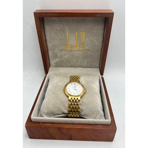 709 - Limited edition Dunhill Elite 18 carat gold wristwatch. Weight 71gm.