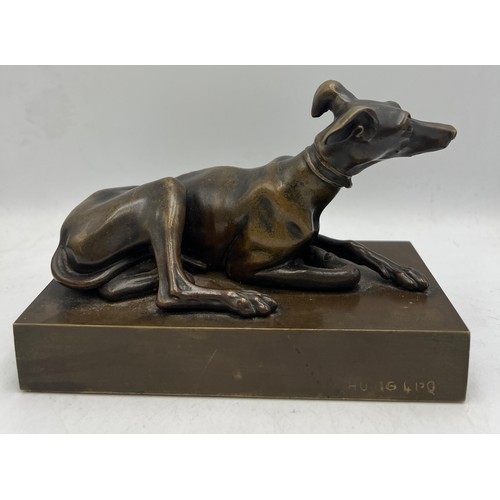 1179 - A 19thC bronze recumbent greyhound 15.5cm x 7.5cm.