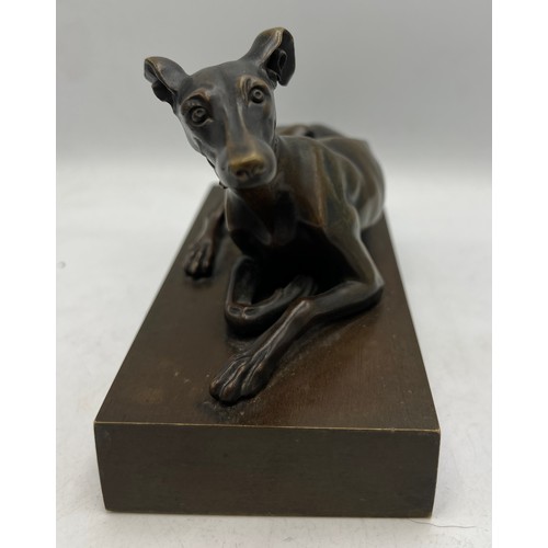 1179 - A 19thC bronze recumbent greyhound 15.5cm x 7.5cm.