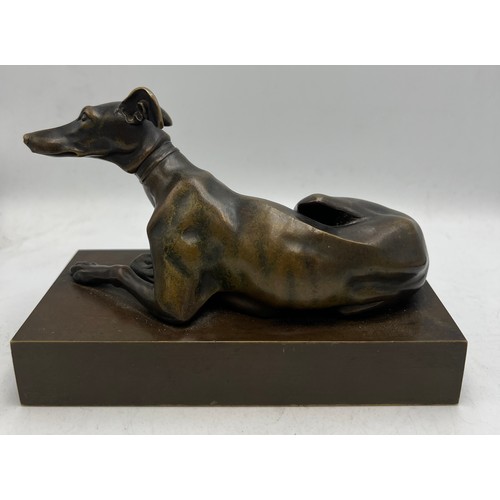 1179 - A 19thC bronze recumbent greyhound 15.5cm x 7.5cm.