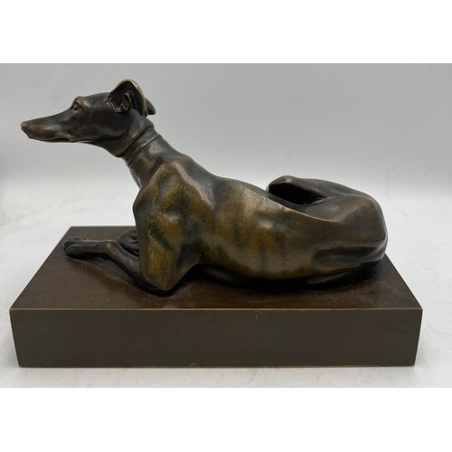 1179 - A 19thC bronze recumbent greyhound 15.5cm x 7.5cm.