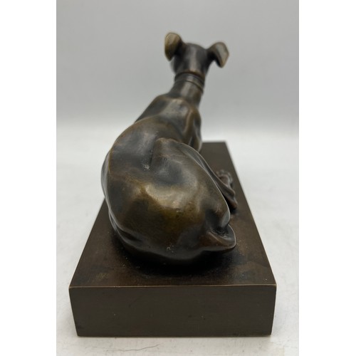 1179 - A 19thC bronze recumbent greyhound 15.5cm x 7.5cm.