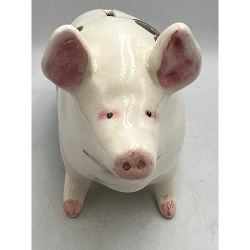 398 - A Wemyss Plichta pig money box. 17cm l.