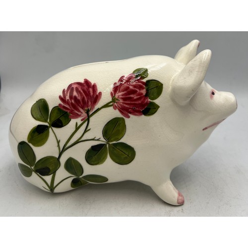 398 - A Wemyss Plichta pig money box. 17cm l.