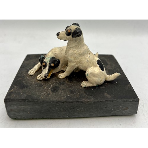 1182 - Two cold painted bronze terriers on a slate base. 10.5cm x 7cm.