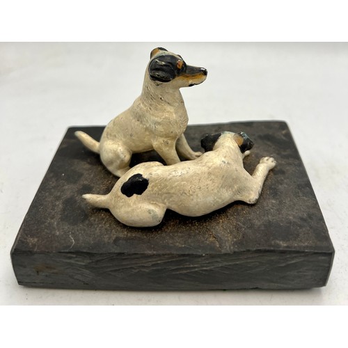 1182 - Two cold painted bronze terriers on a slate base. 10.5cm x 7cm.