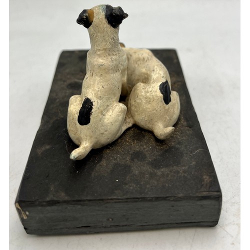 1182 - Two cold painted bronze terriers on a slate base. 10.5cm x 7cm.