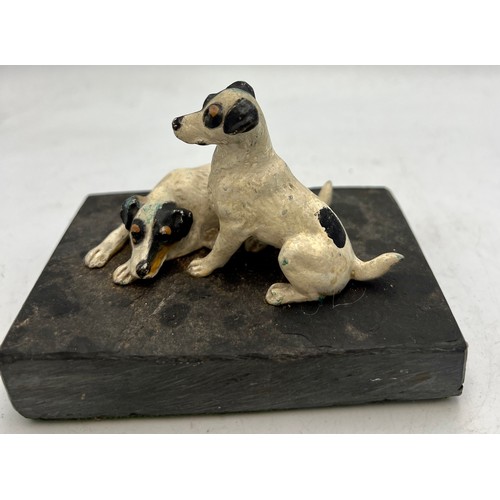 1182 - Two cold painted bronze terriers on a slate base. 10.5cm x 7cm.