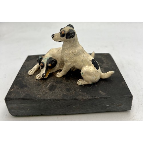 1182 - Two cold painted bronze terriers on a slate base. 10.5cm x 7cm.