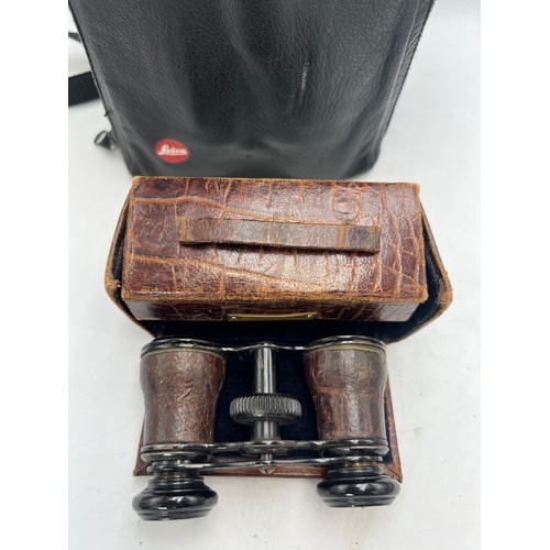 959 - A pair of Leica 7x42 BA Trinovid binoculars in Leica soft case together with cased vintage opera gla... 