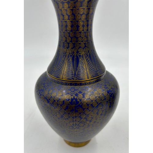 934 - A pair of 19thC Chinese cloisonné vases with blue and gold pattern 16cm. (2).