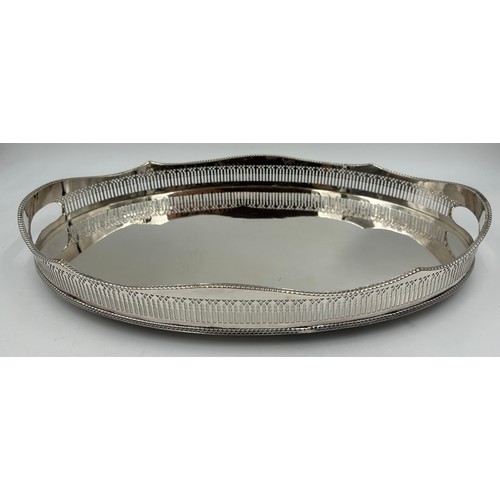 767 - A quantity of silverplated items to include a large pierced gallery tray 46cm, round serving tray 30... 