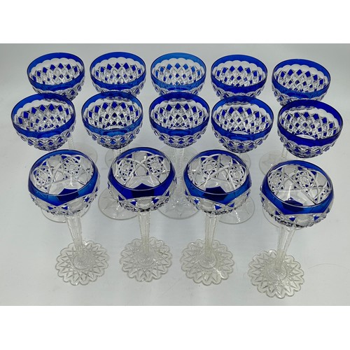 494 - A set of 10 x blue Val St Lambert cut glass rounded hock glasses with hexagonal stems and decorated ... 