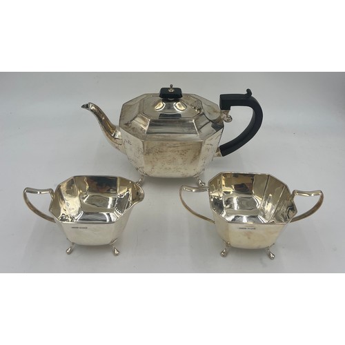 801 - A three piece silver tea service Sheffield 1945, with ebony knop and handle, maker Harrison, Fisher ... 