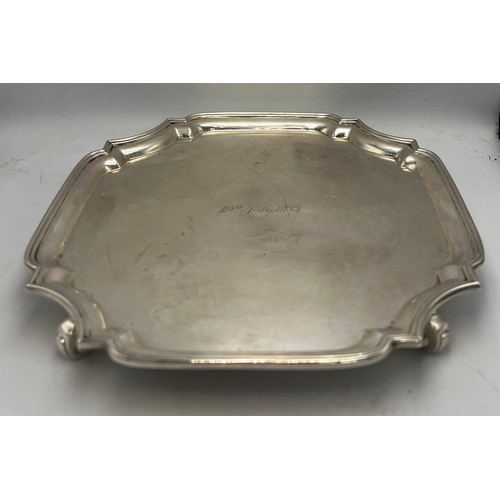 802 - Silver salver raised on four scroll feet, Sheffield 1932, maker Northern Goldsmiths company. Weight ... 