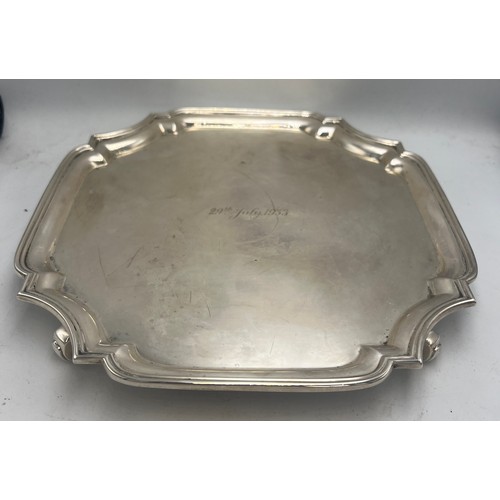 802 - Silver salver raised on four scroll feet, Sheffield 1932, maker Northern Goldsmiths company. Weight ... 