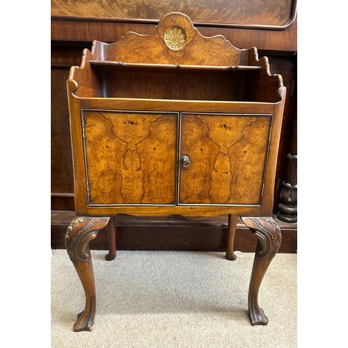 35 - A burr walnut two door cabinet on cabriole legs. 50 w x 34 d x 82.5cm h.