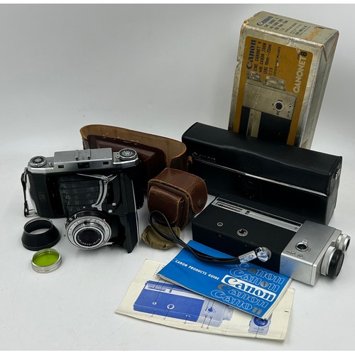 960 - Two vintage cameras to include a Zeiss Ikonta with f:105mm lens, original part case and a green lens... 