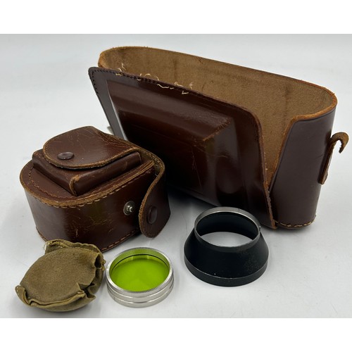 960 - Two vintage cameras to include a Zeiss Ikonta with f:105mm lens, original part case and a green lens... 