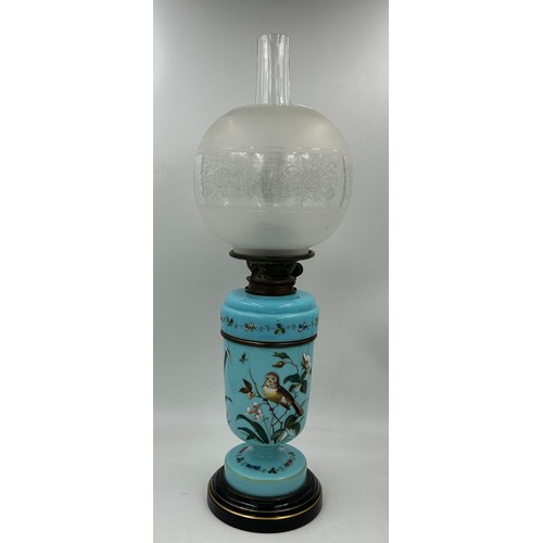 973 - A Hinks & Son Victorian two section oil lamp with blue opaline body painted with birds and flowers w... 