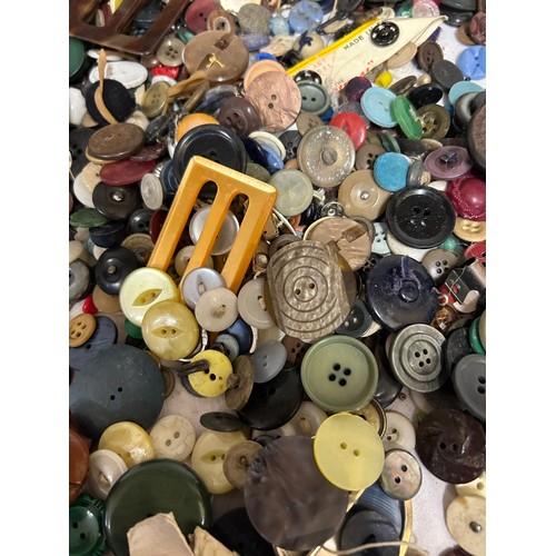 872 - A collection of buttons all different shapes, sizes and colours with two vintage tins.