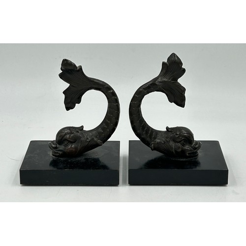 1188 - A collection of bronze, brass and metal figures to include a pair of heavy dolphins on metal bases, ... 